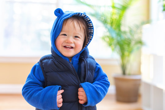 Happy Toddler Boy Bundled Up In Winter Clothes Ready To Go Outside