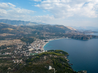 Obraz premium Aerial view of Himara, Albania in autumn. Beautiful beach town along the Albanian Riviera