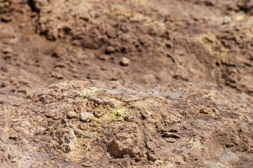 Background of volcanic crater surface with poisonous sulfur and stones - 233927833