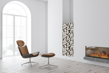 White frieplace and brown armchair