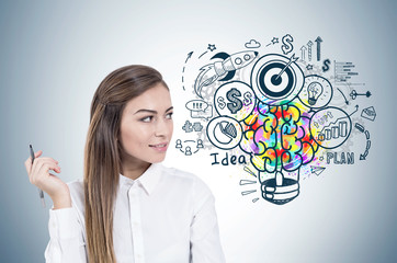 Smiling woman with pen, business idea