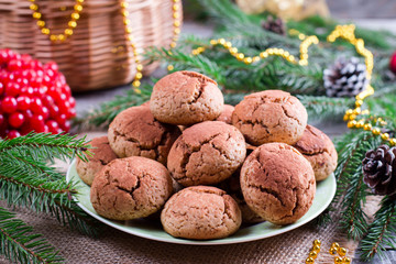 Fototapeta na wymiar Chocolate cookies. Cookie with cracks. Christmas chocolate cookies. Christmas biscuits. Chocolate cookies with cracks.