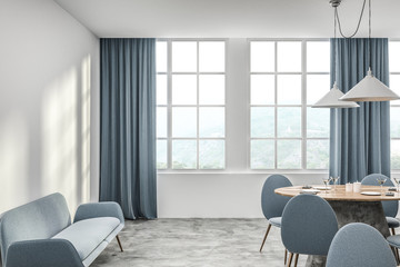 White cafe interior with blue sofa