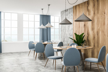 Wood and white loft cafe interior, blue chairs