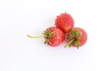 red strawberries on white background, healthy berry fruits , red fruit background