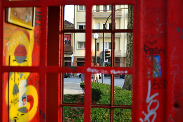 Fototapeta na wymiar Porto, Portugal - 09/17/2017: a red telephone box on the street