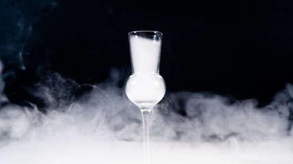 schnaps glass full of smoke, shot glas filled with smoke - obrazy, fototapety, plakaty