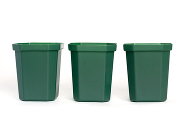 Empty plastic green flower pots isolated on white background.