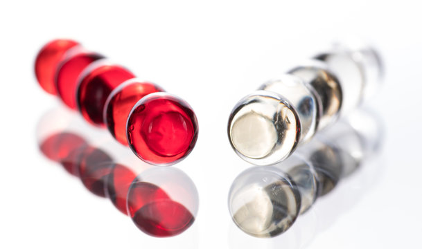 Small red medicine capsules containing nitroglycerin, validol