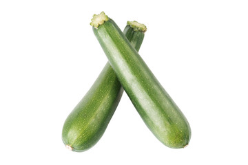 Two whole ripe green zucchini with slices on a white background