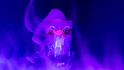 goblet glass full of smoke, goblet glas filled with smoke, smoke inside a glas, blue colour image of a glass filled with smoke