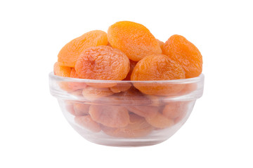 Dried apricots in the glass bowl isolated on white background. Front view