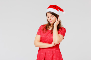 Sad body positive charming beautiful girl brunette in red dress