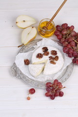 Camembert with honey, pear and grapes
