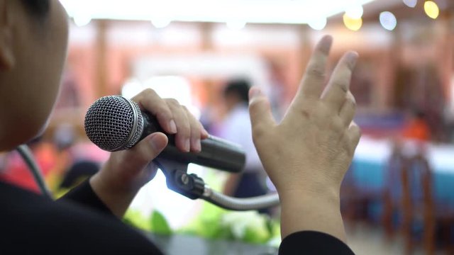 Seminar Conference Concept: Smart Asian business people speech, speaking with microphones keynote in meeting room, talking gesturing protesting or belief for explaining in convention background