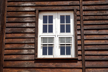 Fototapeta na wymiar The external window and wall of a vintage wood house in the American West .
