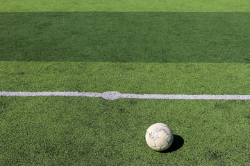Football on artificial turf. It is for green background in a stadium