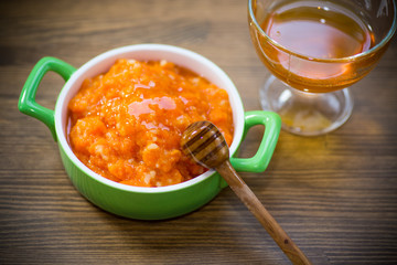 Boiled sweet pumpkin porridge with honey in a plate