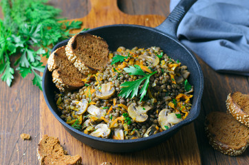 Lentils with Mushrooms, Carrot and Herbs in a Skillet, Healthy Vegetarian Food