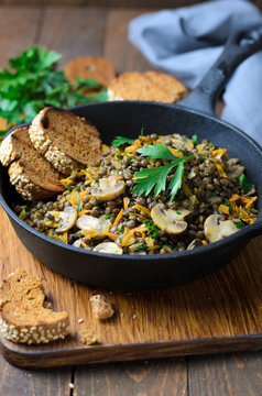 Lentils with Mushrooms, Carrot and Herbs in a Skillet, Healthy Vegetarian Food