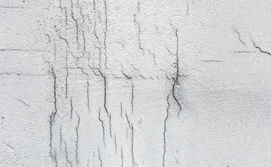 Texture of white dirty cracked wall. Small straight cracks. Direct fracture on painted surface....