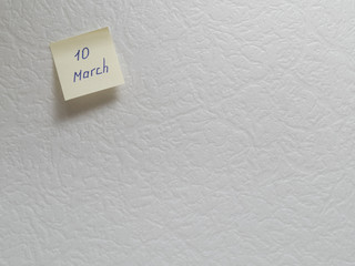 March 10, calendar date sticky note