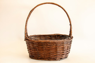 Fototapeta na wymiar empty wicker basket on soft light background / copy space