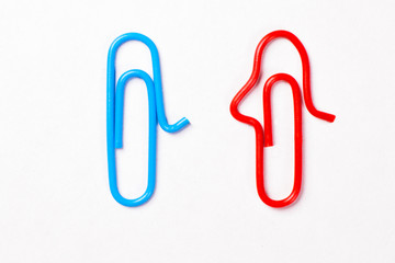 paper clips in the form of men and women blue and red