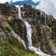 Fototapeta na wymiar mountain waterfall from Ushba glasier river Georgia Svaneti