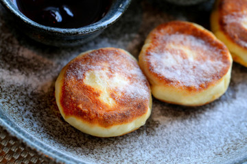 Macro photo of delicious bright cheese cakes with jam and sour c