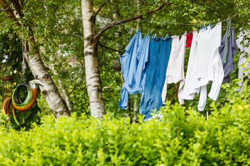 Laundry drying outside in green scenery