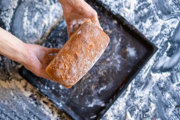 baker cook hands hold give fresh made bread f