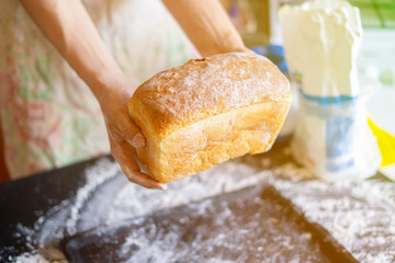 baker cook hands hold give fresh made bread f