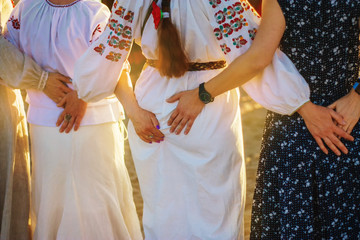 Female hands hold each other's butt