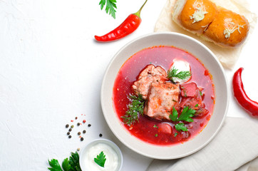 Borscht, Red Soup Made of Beetroot and Vegetables with Pork Ribs and Sour Cream Served with Garlic Rolls, Ukrainian, Russian and Polish Traditional Dish