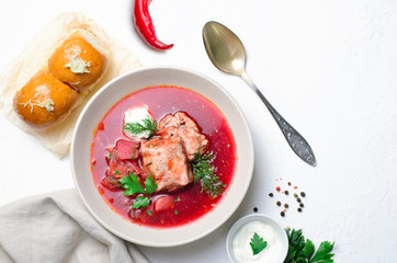 Borscht, Red Soup Made of Beetroot and Vegetables with Pork Ribs and Sour Cream Served with Garlic Rolls, Ukrainian, Russian and Polish Traditional Dish