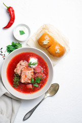 Borscht, Red Soup Made of Beetroot and Vegetables with Pork Ribs and Sour Cream Served with Garlic Rolls, Ukrainian, Russian and Polish Traditional Dish