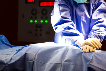 Closeup Doctor performing CPR for his patient in ICU room. Emergency CPR.