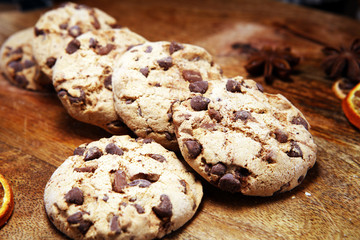 Chocolate cookies on wooden table. Chocolate chip cookies shot