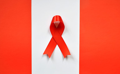 Red ribbon on white background. World Aids Day concept