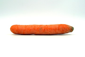Orange winter carrot against a white background.