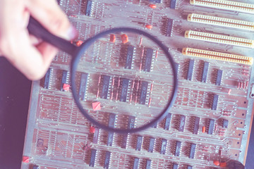micro or nano electronic board reapir concept, hand hold magnifying glass f