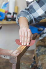 woman restoring furniture