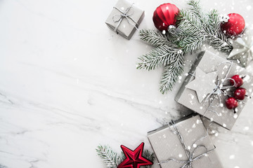 Christmas and New Year holiday background. Xmas greeting card. Christmas gifts on white marble background top view. Flat lay