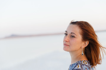 Close up portrait of pretty girl enjoying sun, traces of salt on the face