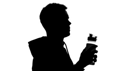 Fototapeta na wymiar Male silhouette holding bottle with water after workout, aqua balance, hydration