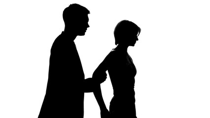 Male holding female, stopping from walking away during conversation, crisis