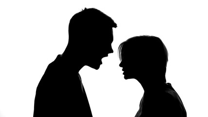 Silhouettes of arguing husband and wife, stressful environment at home, problems
