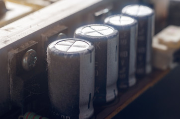 A thick layer of dust covers the internal electronic components of the computer