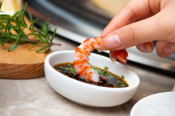Enjoying chinese style steamed seafood. Studio photos without face. 